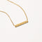 Cosmic Star Bar Necklace in Gold flat lay shot