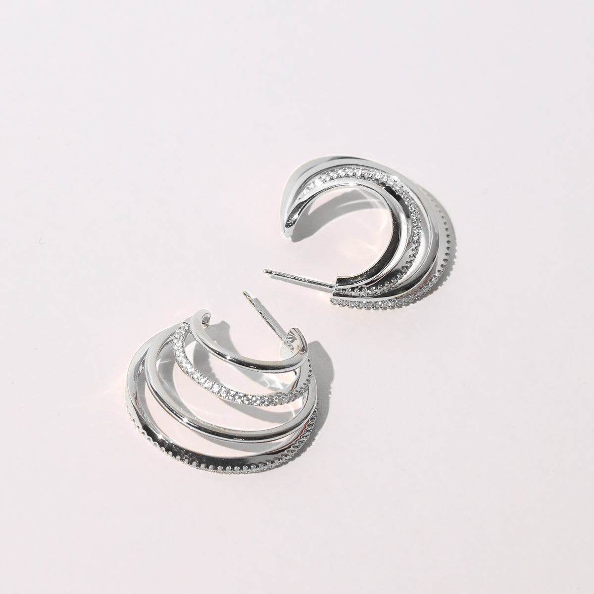 Orbit Crystal Hoops in Silver Flat Lay