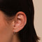 Orbit Crystal Huggies in Gold worn