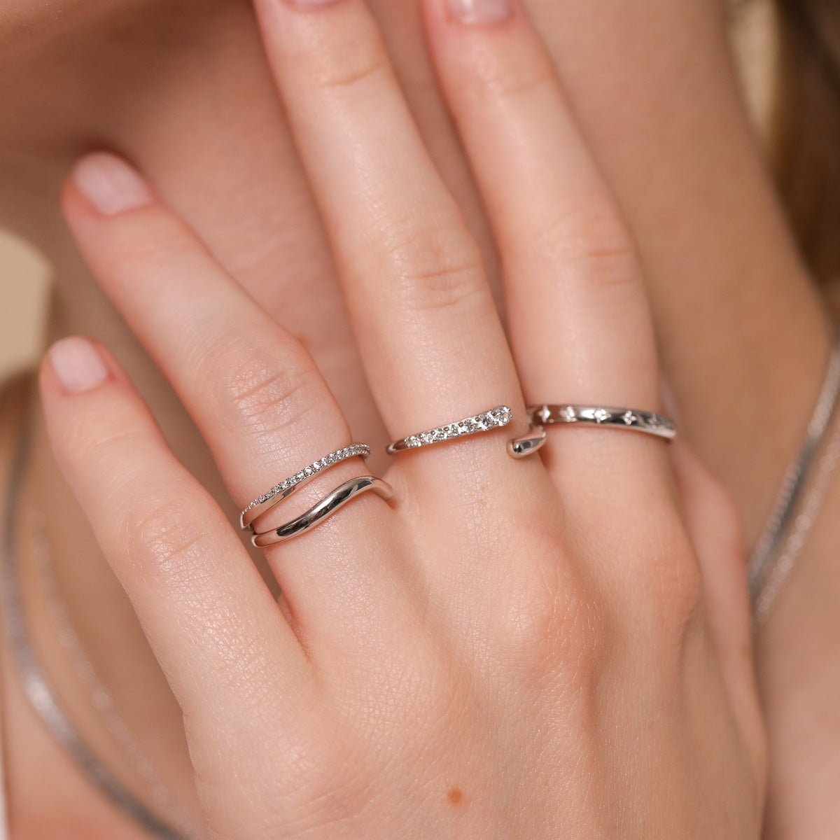 Orbit Crystal Band Ring in Silver worn with other rings