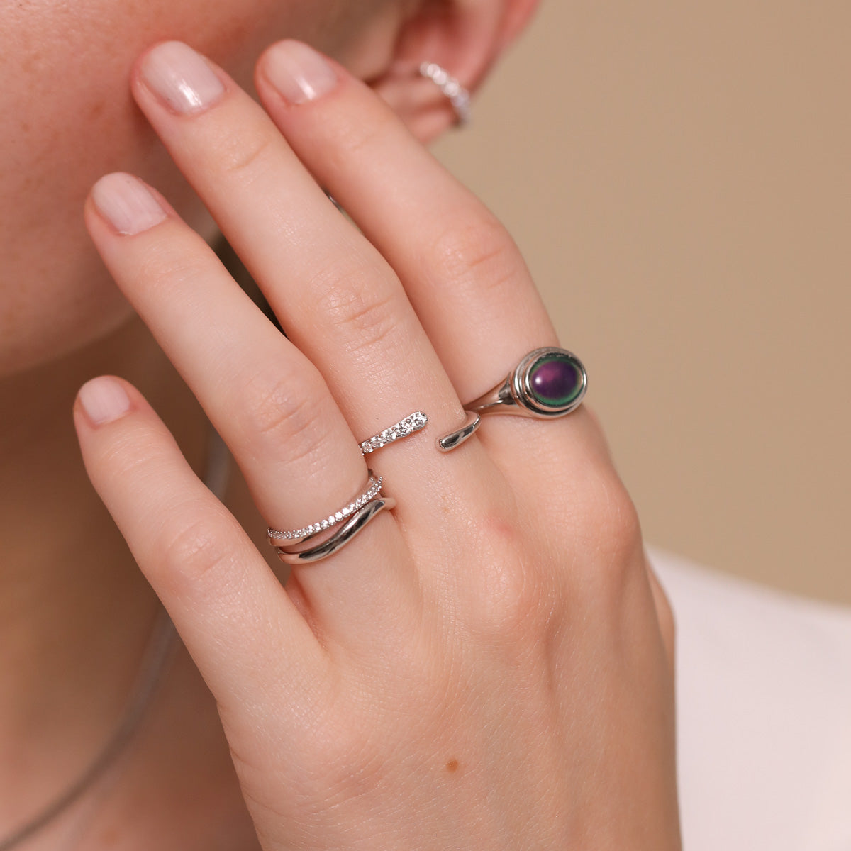 Orbit Crystal Ring in Silver worn with other rings