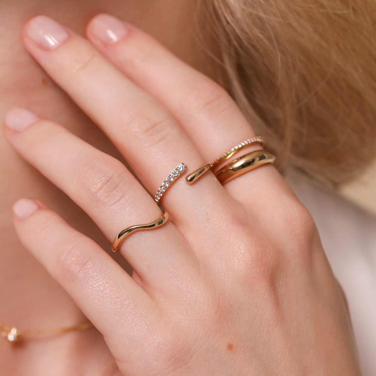 Orbit Crystal Ring in Gold worn with other rings