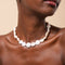Opulent Pearl Necklace in Gold worn
