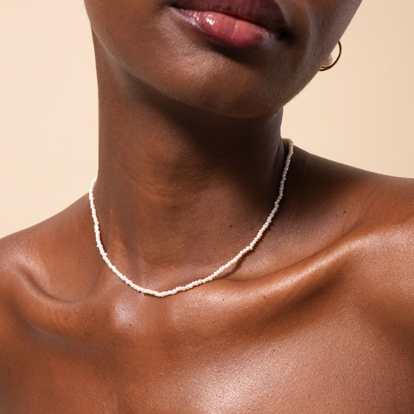 Radiant Pearl Necklace in Gold worn