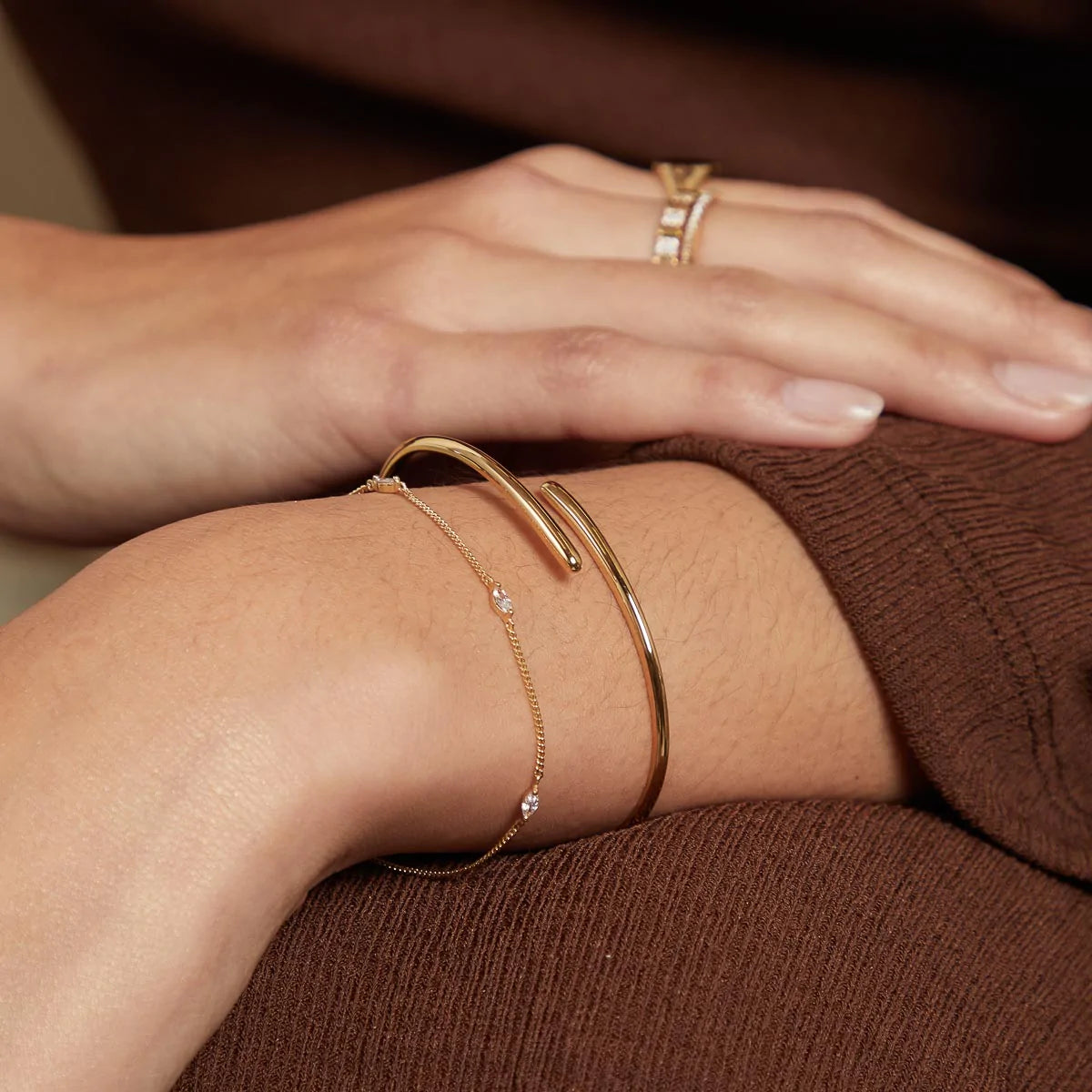 Twist Cuff in Gold worn with another bracelet