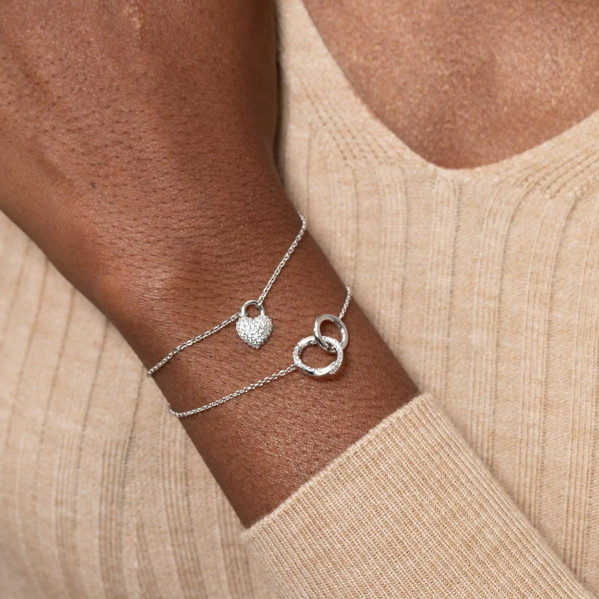 Heart Pave Bracelet in Silver worn layered with orbit crystal bracelet