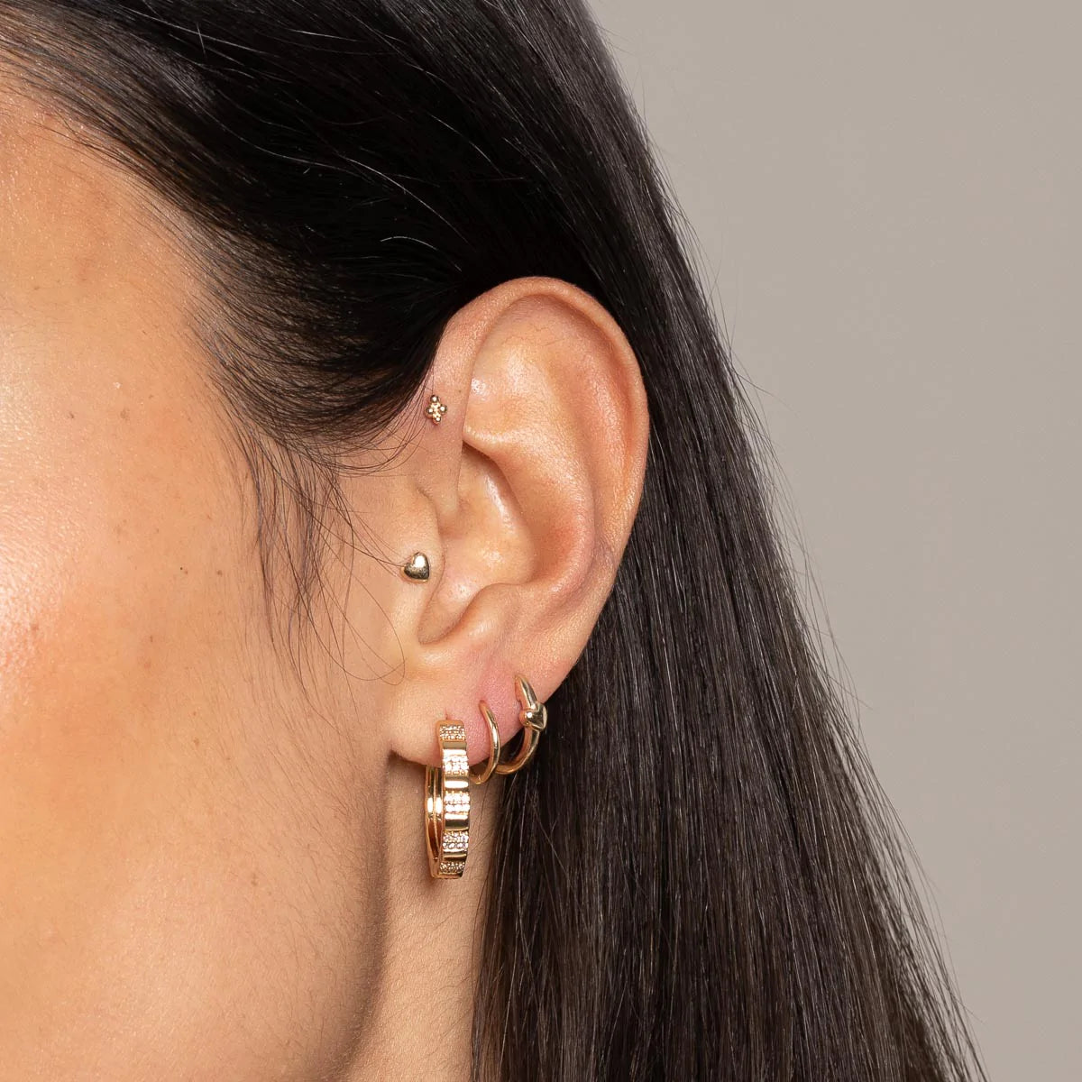 Pleated Crystal Hoops in Gold worn layered with earrings
