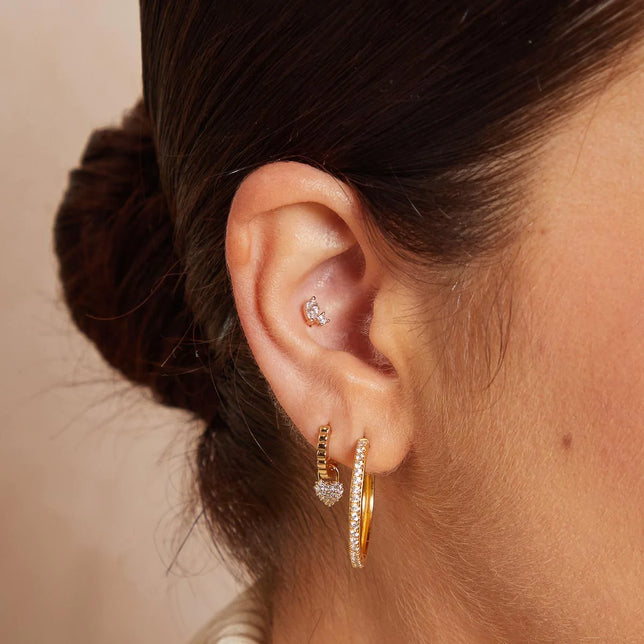 Heart Pave Charm Huggies in Gold worn with other earrings