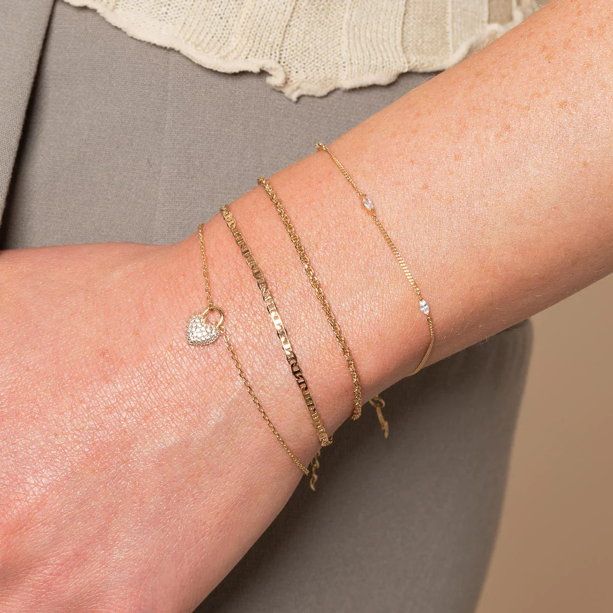 Station Navette Crystal Bracelet in Gold worn with other bracelets
