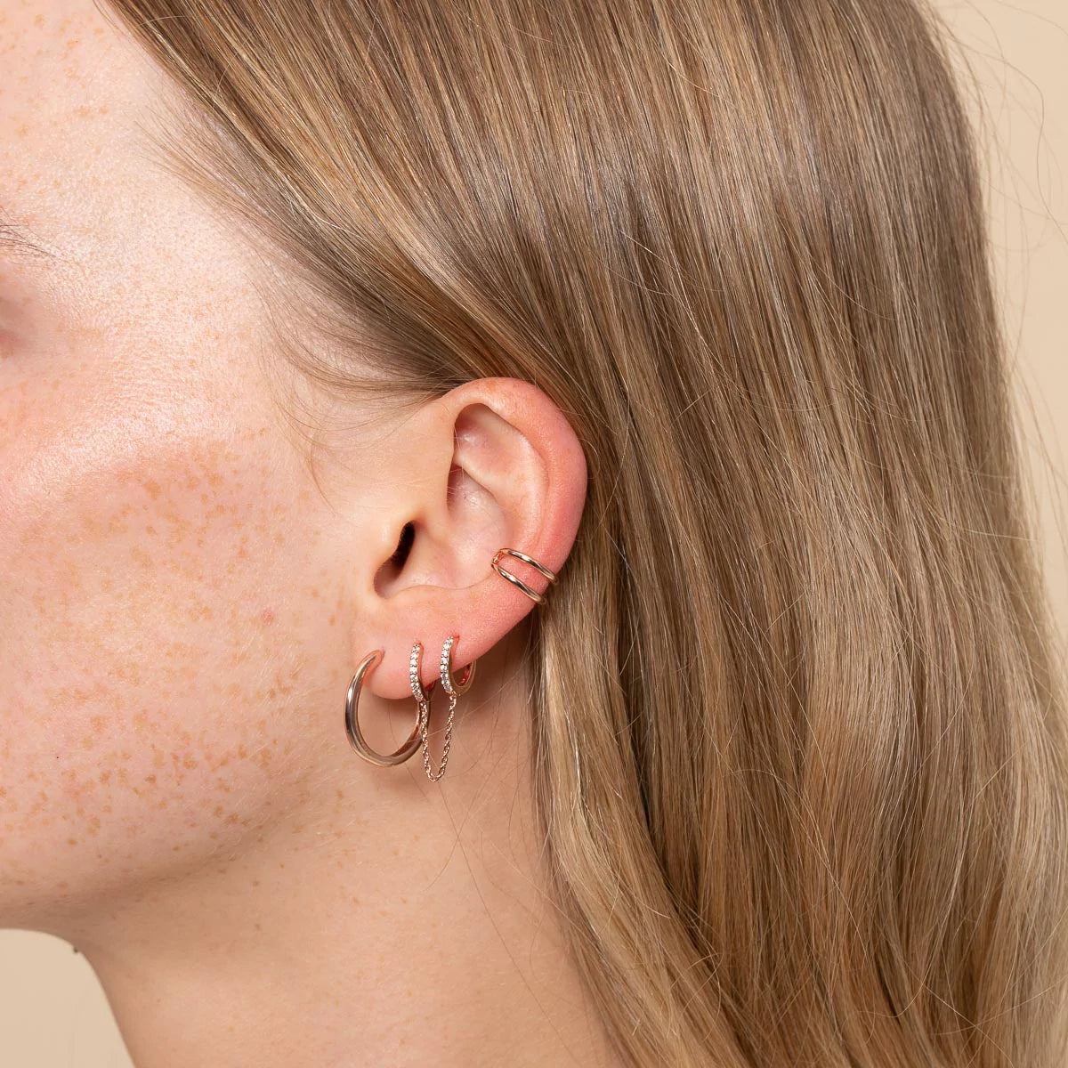 Illusion Essential Ear Cuff in Rose Gold worn with other earrings