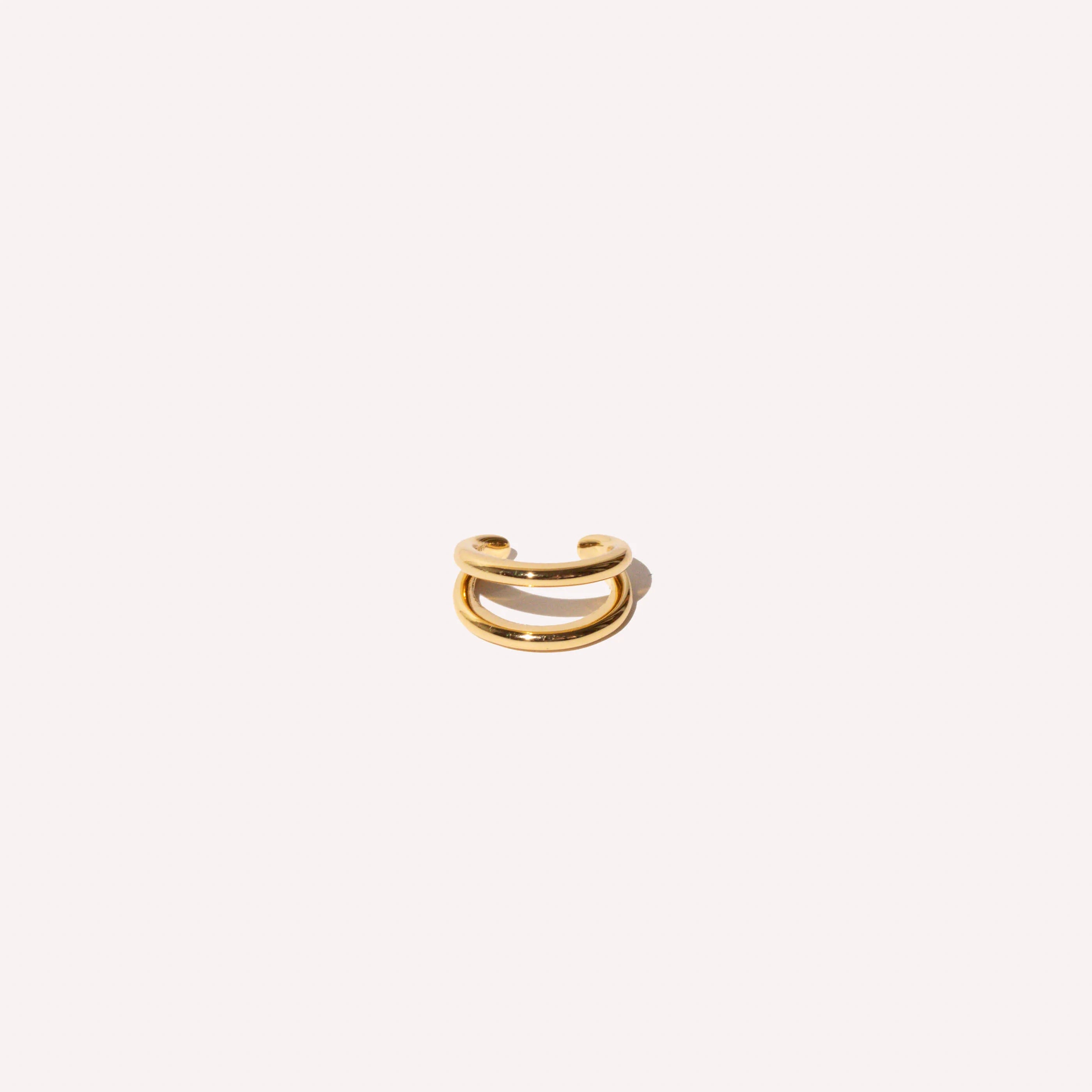 Illusion Essential Ear Cuff in Gold flat lay