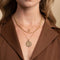 Bold Zodiac Aquarius Pendant Necklace in Gold worn layered with rope chain necklace and bold halo necklace