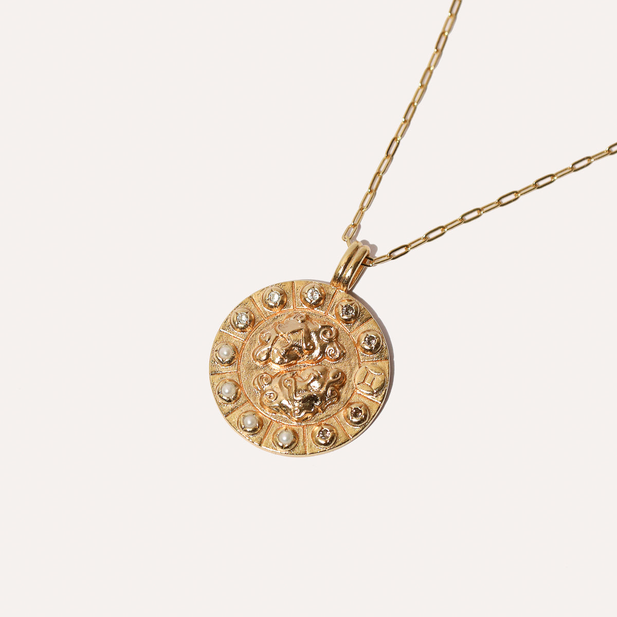 Bold Zodiac Gemini Pendant Necklace in Gold flat lay