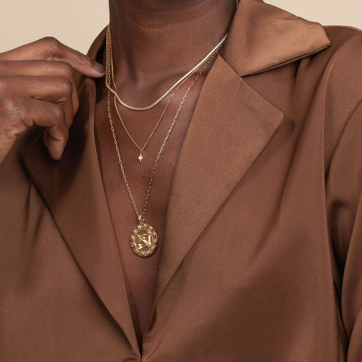 Sagittarius Bold Zodiac Pendant Necklace in Gold worn layered with necklaces