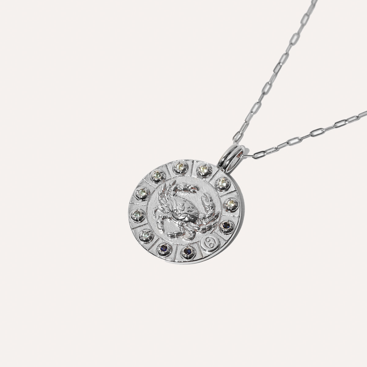 Cancer Bold Zodiac Pendant Necklace in silver flat lay