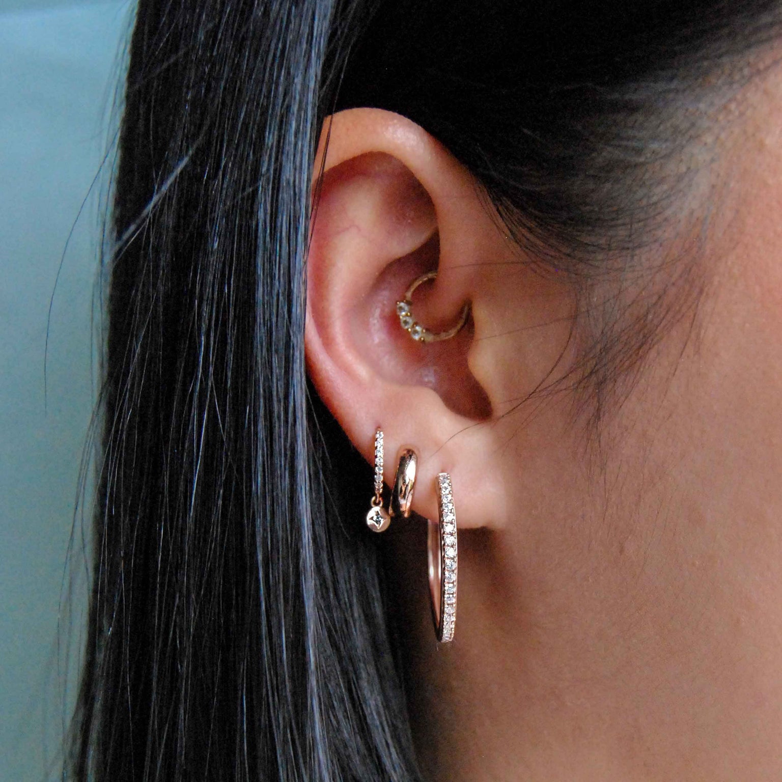 Bold Huggies in Rose Gold worn in second lobe piercing