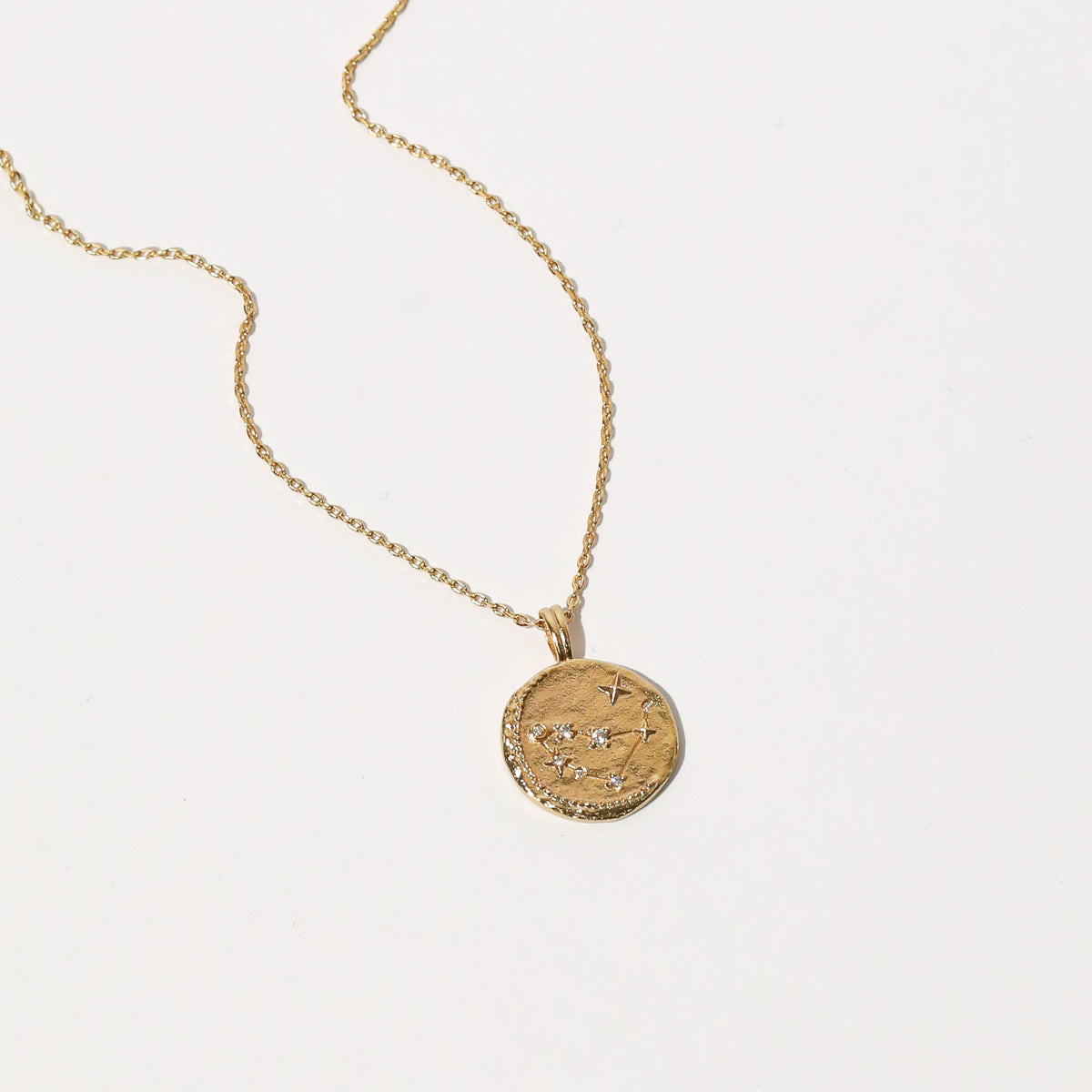 Close up shot of the front of the Capricorn Zodiac Pendant Necklace in Gold