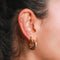 Cosmic Dome Hoops in Gold worn with other gold earrings