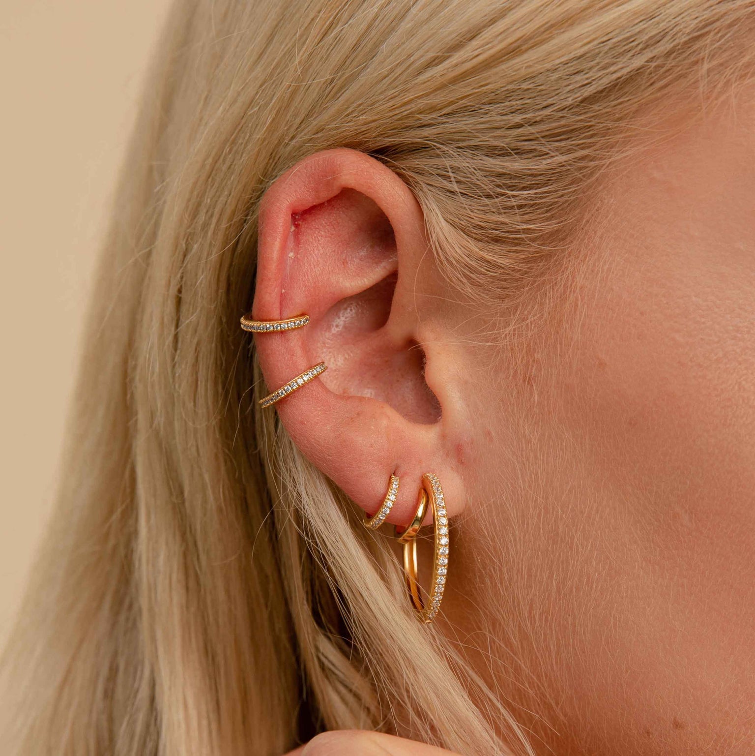 Crystal Ear Cuff in Gold worn with jewelled earrings