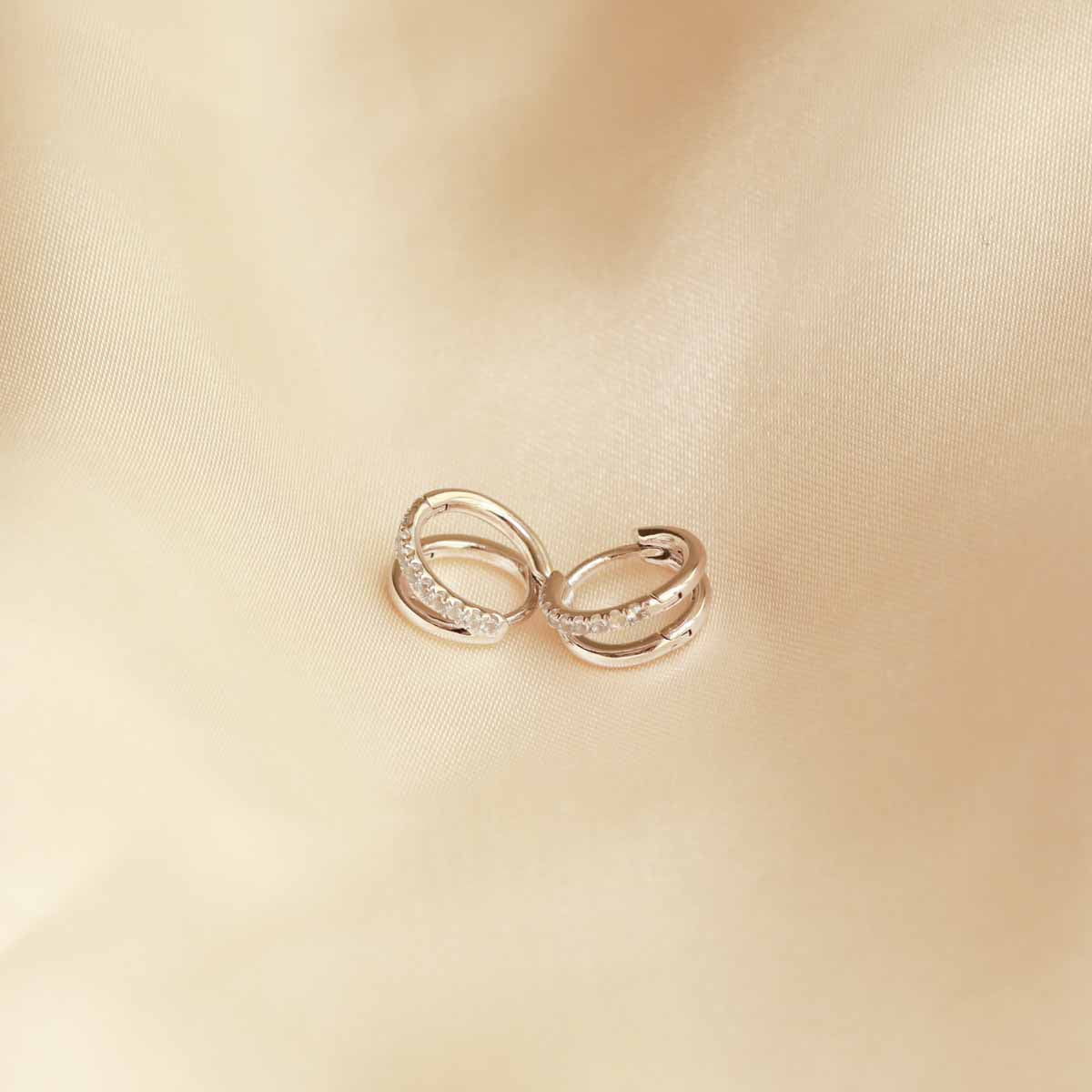 Flat late shot of Duo Aquamarine Hoops in Silver