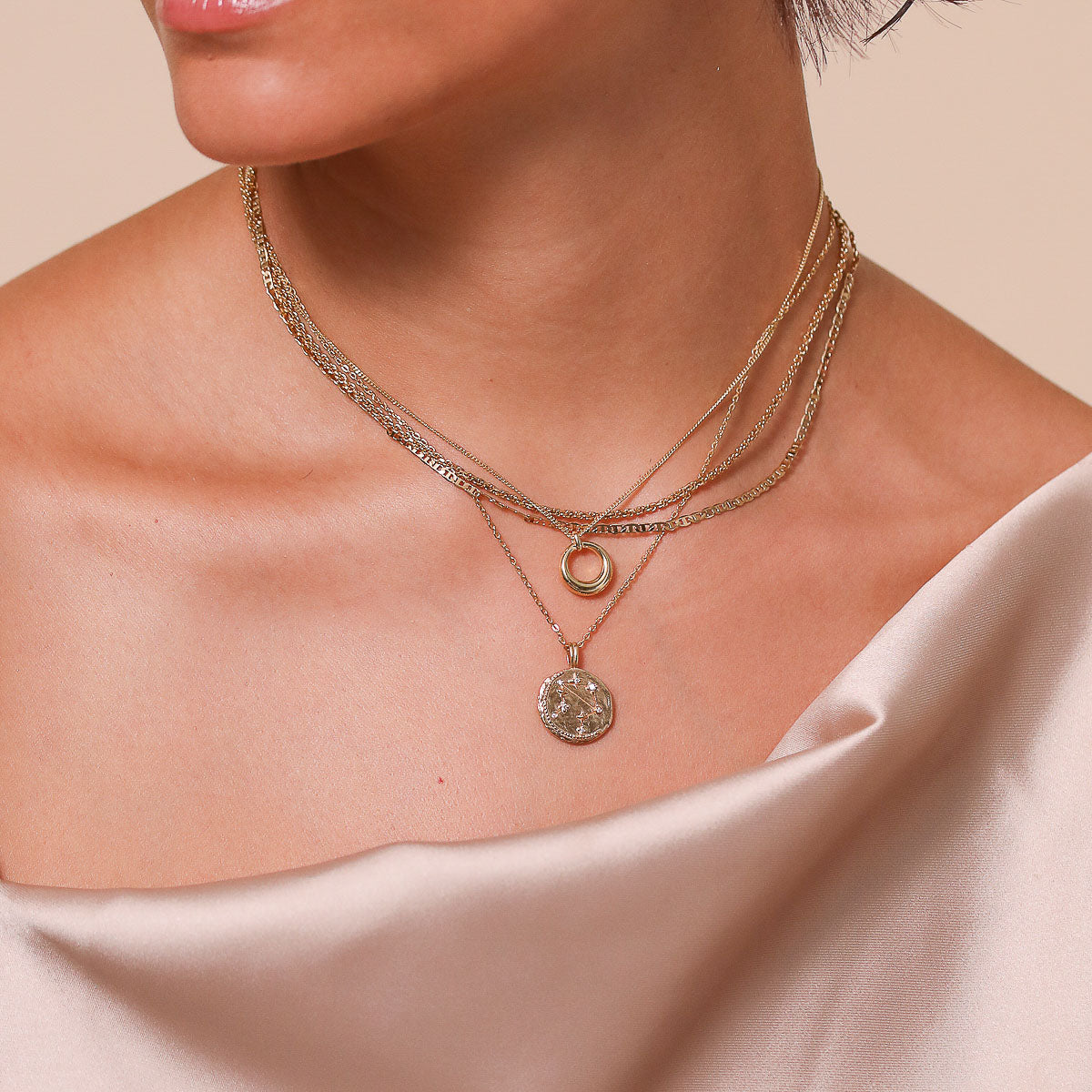 Libra Zodiac Pendant Necklace in Gold worn layered with necklaces