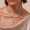 Pisces Zodiac Pendant Necklace in Silver worn layered with necklaces