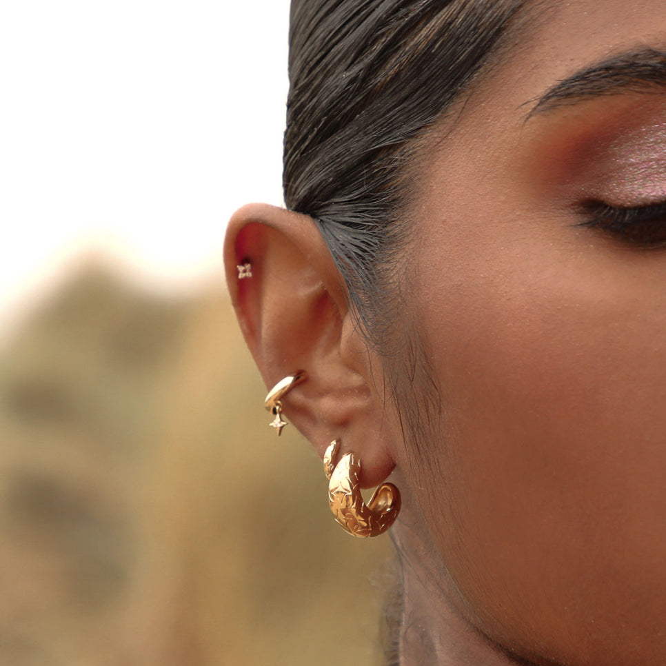 Cosmic Star Charm Ear Cuff in Gold worn