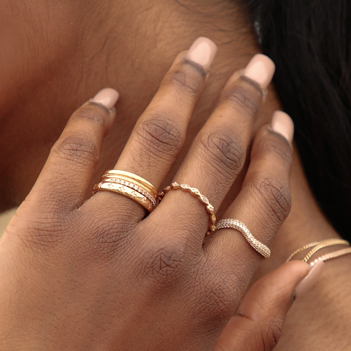 Cosmic Star Stacking Ring in Gold worn stacked with other rings