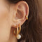 Bold Huggies in Gold worn in helix piercing