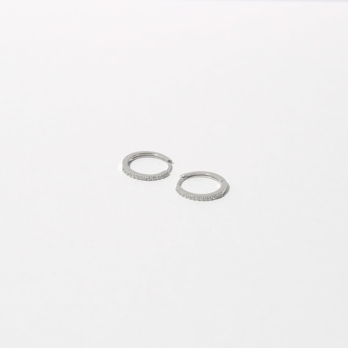 Topaz Hoops in Solid White Gold flat lay