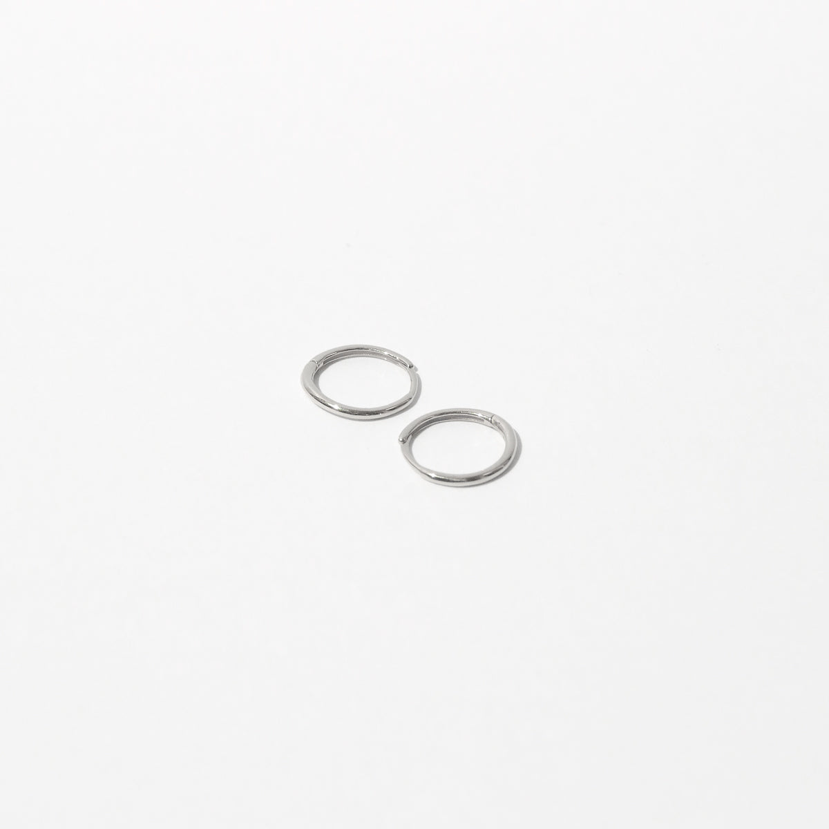 Simple Hoops in Solid White Gold flat lay