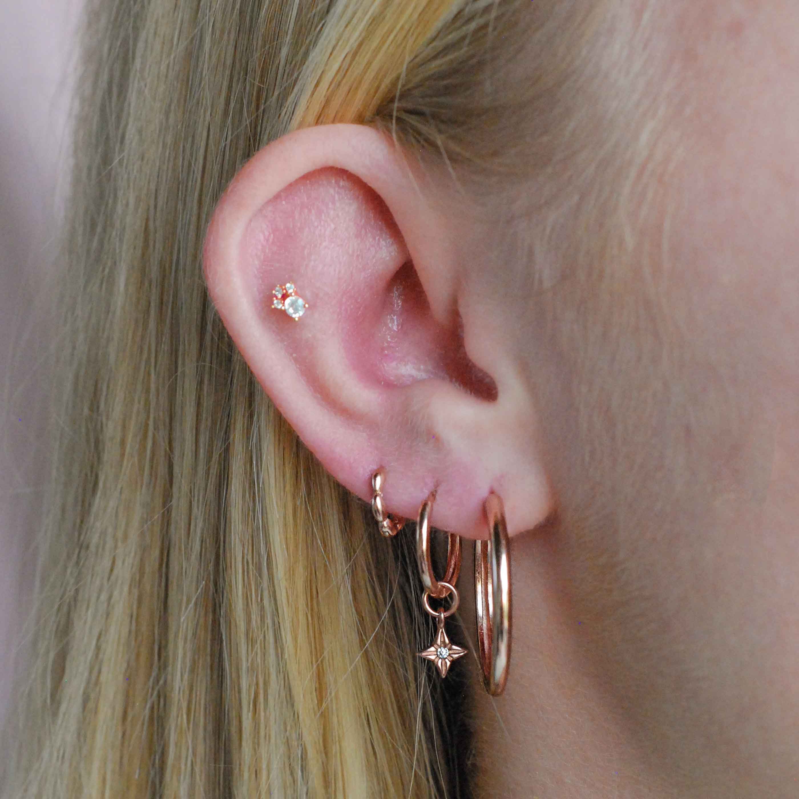 Simple Hinge Hoops in Rose Gold worn with hoops and clickers
