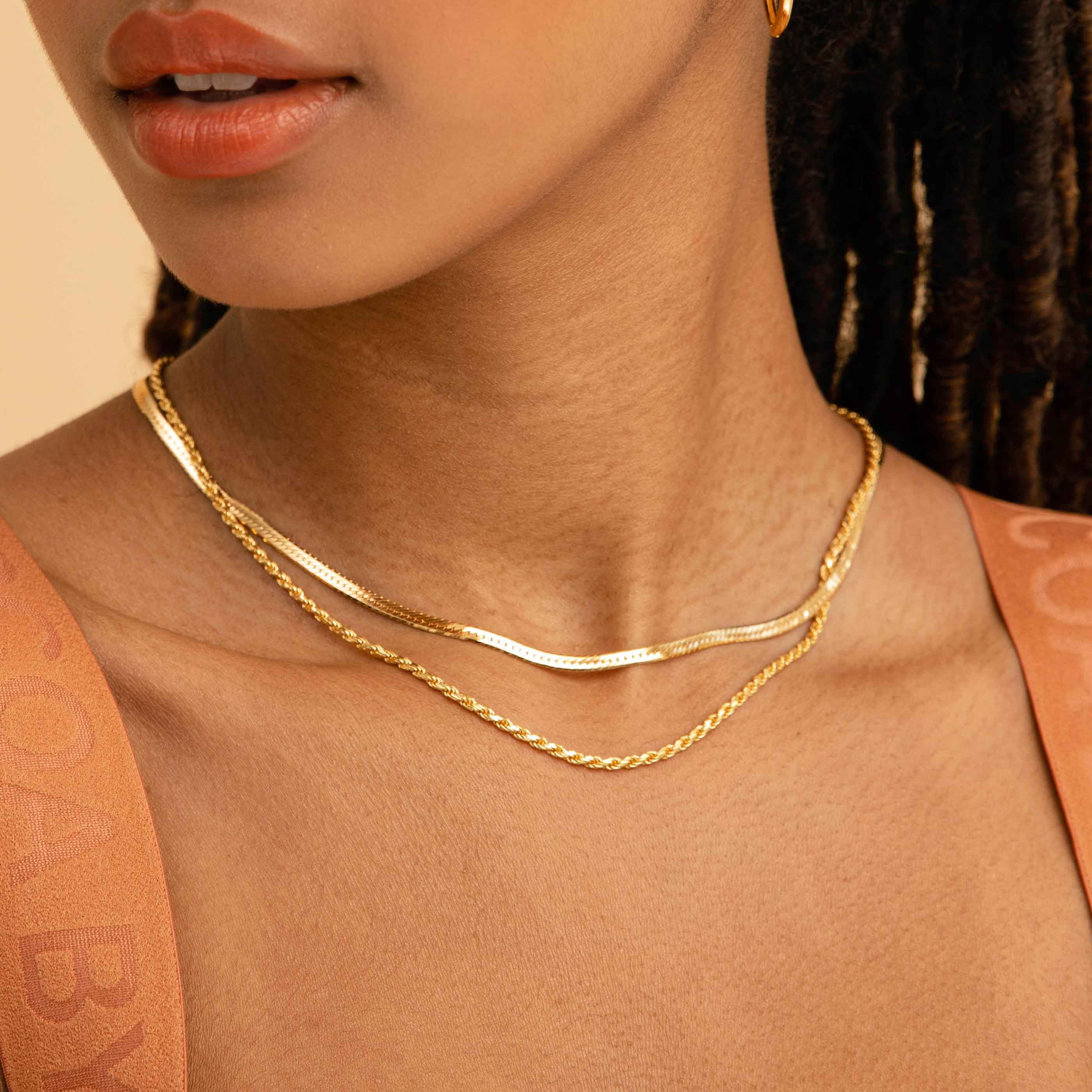 Snake Chain Necklace in Gold worn with rope chain necklace in gold