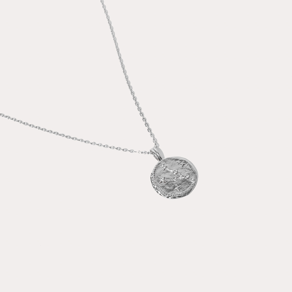 Close up shot of the front of the Taurus Zodiac Pendant Necklace in Silver