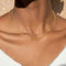 rope chain necklace in gold worn with dainty gold chains