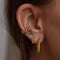 Emerald & Crystal Barbell in Gold worn in third lobe piercing