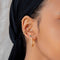 Emerald & Crystal Barbell in Gold worn in second lobe piercing