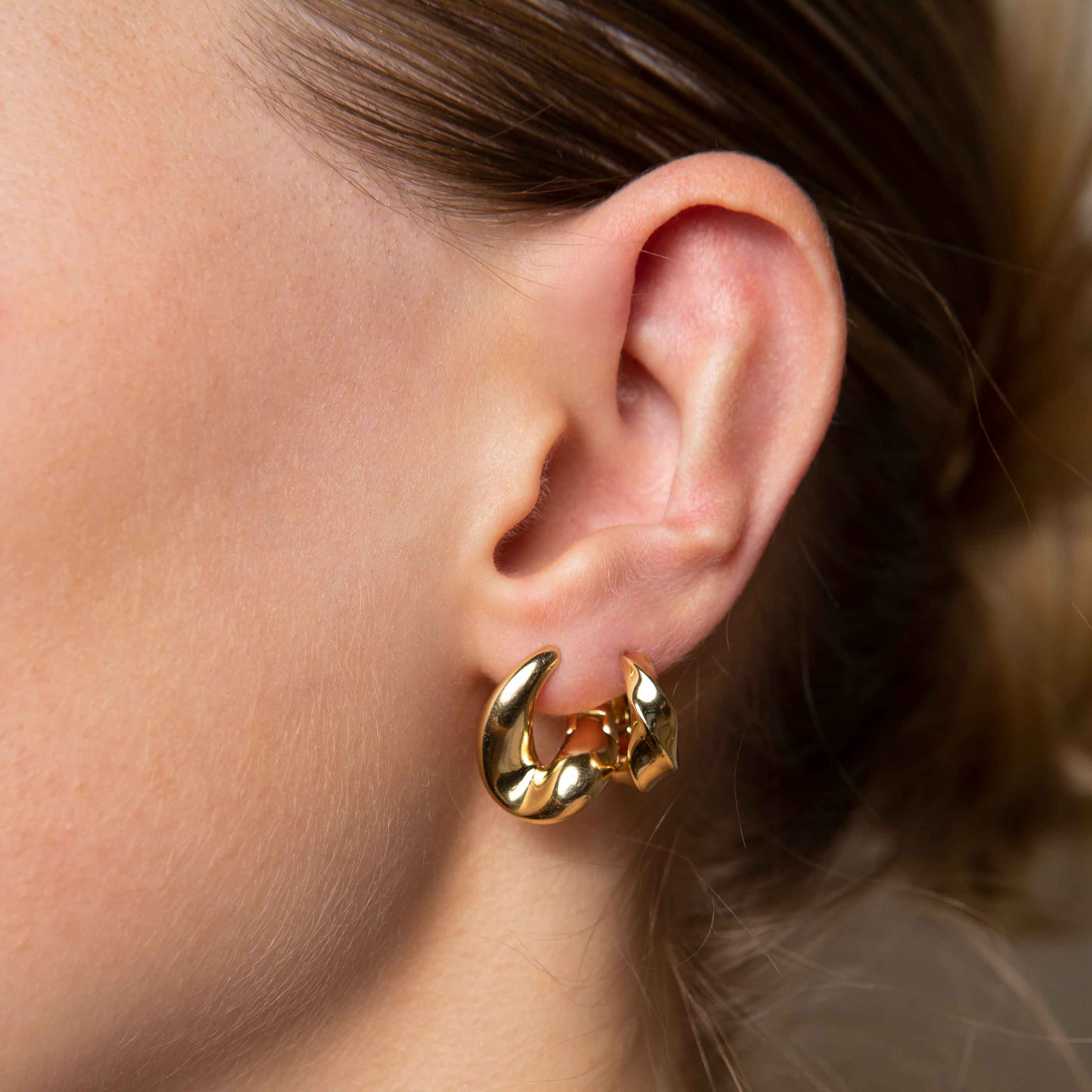 Elemental Hoops in Gold worn with molten hoops