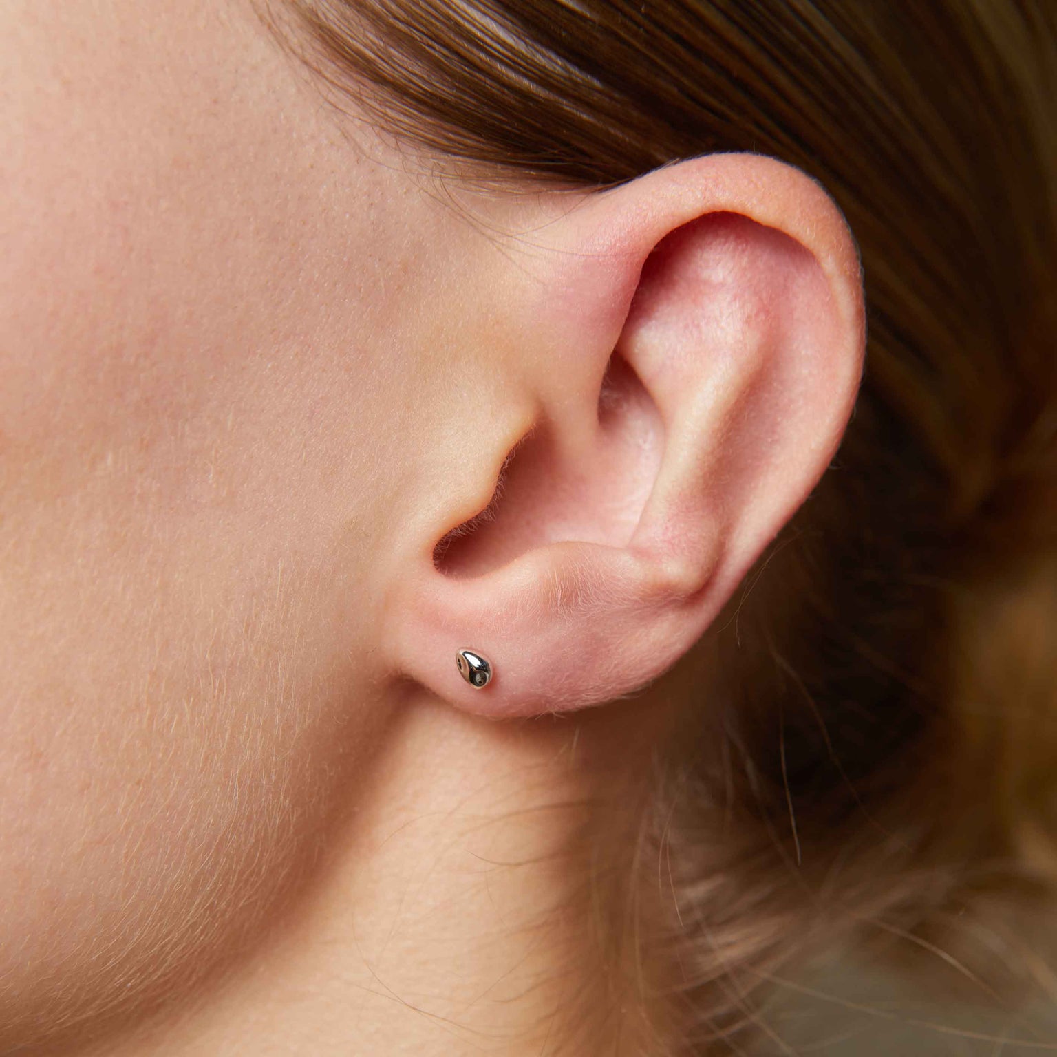 Molten Stud Earrings in Silver worn