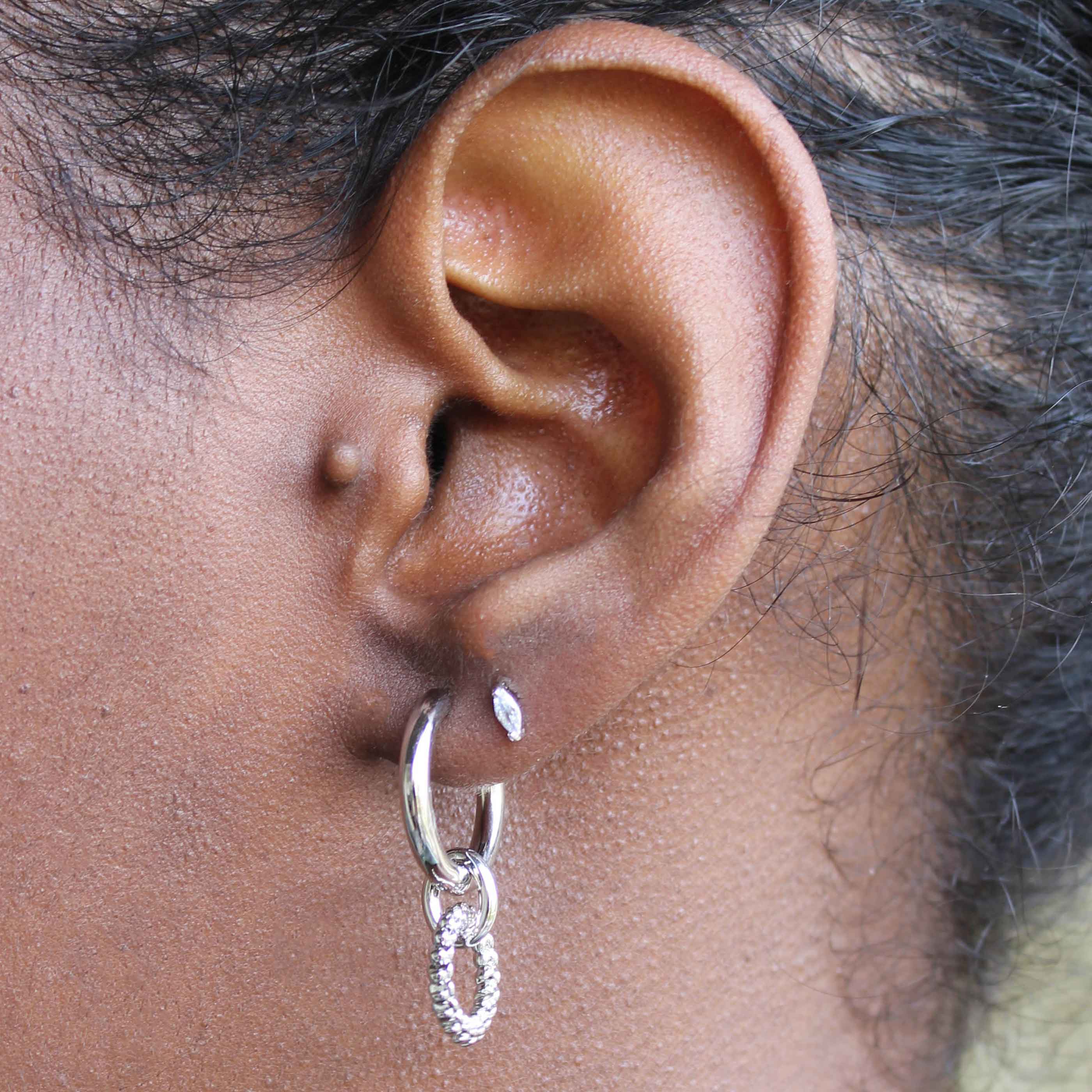 Navette Stud Earrings in Silver worn in second lobe piercing