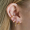 Navette Stud Earrings in Gold worn in outer conch