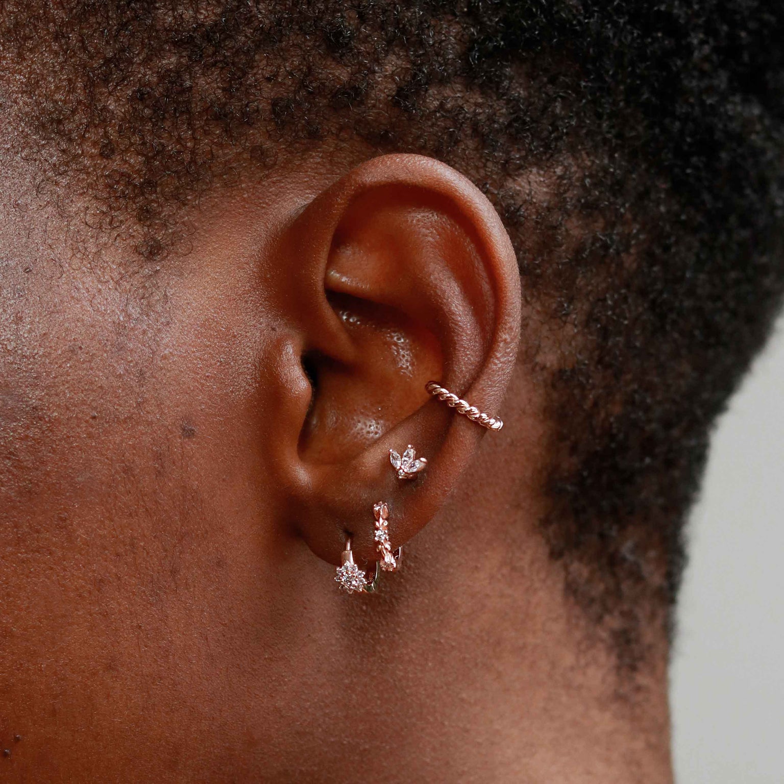 Rope Ear Cuff in Rose Gold worn with huggies and barbells