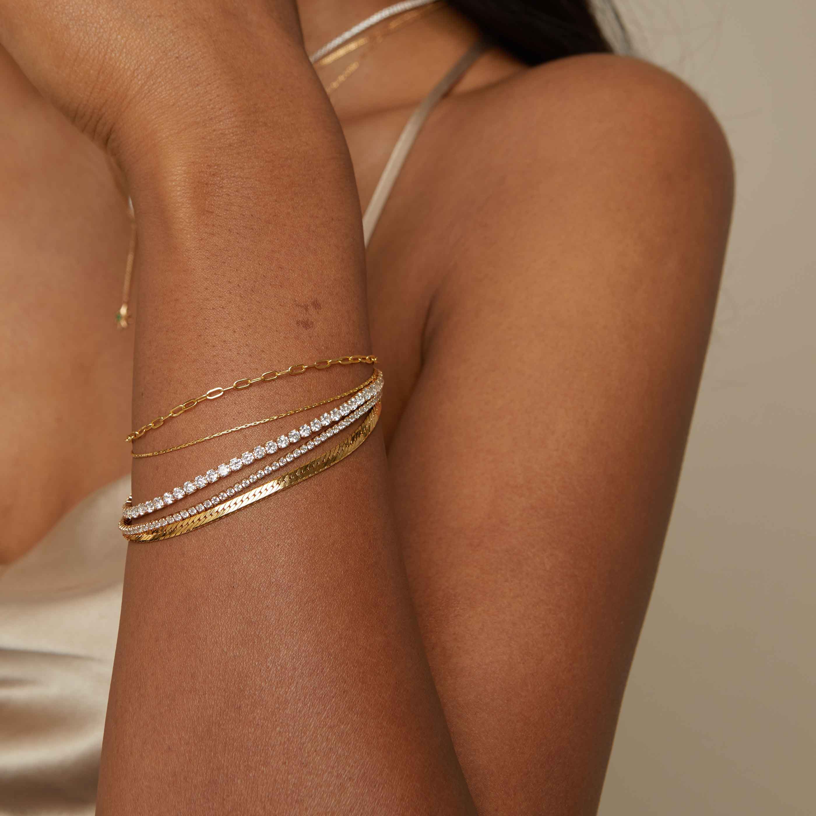 Bold Tennis Chain Bracelet in Gold worn layered