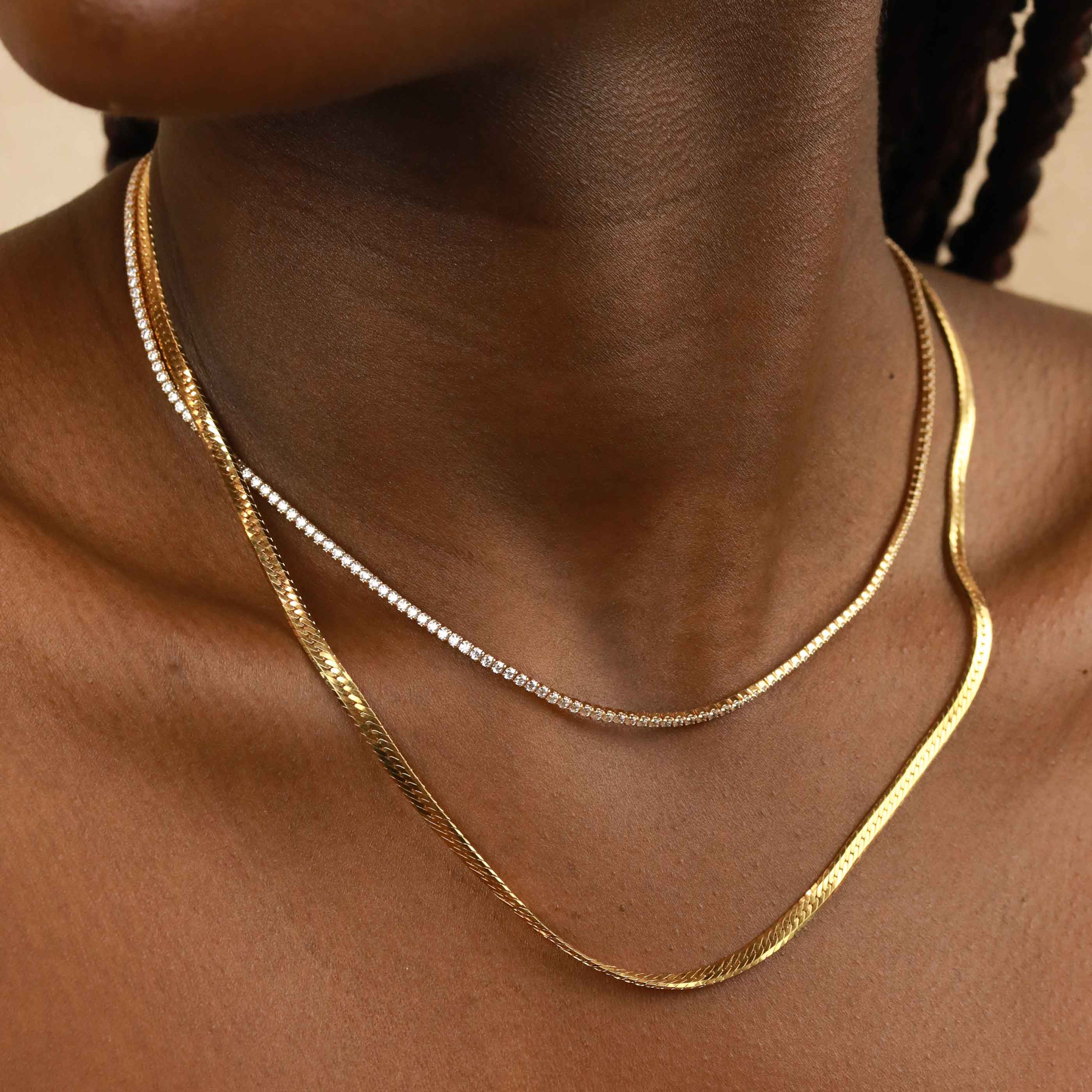 Tennis Chain Necklace in Gold layered with snake chain necklace