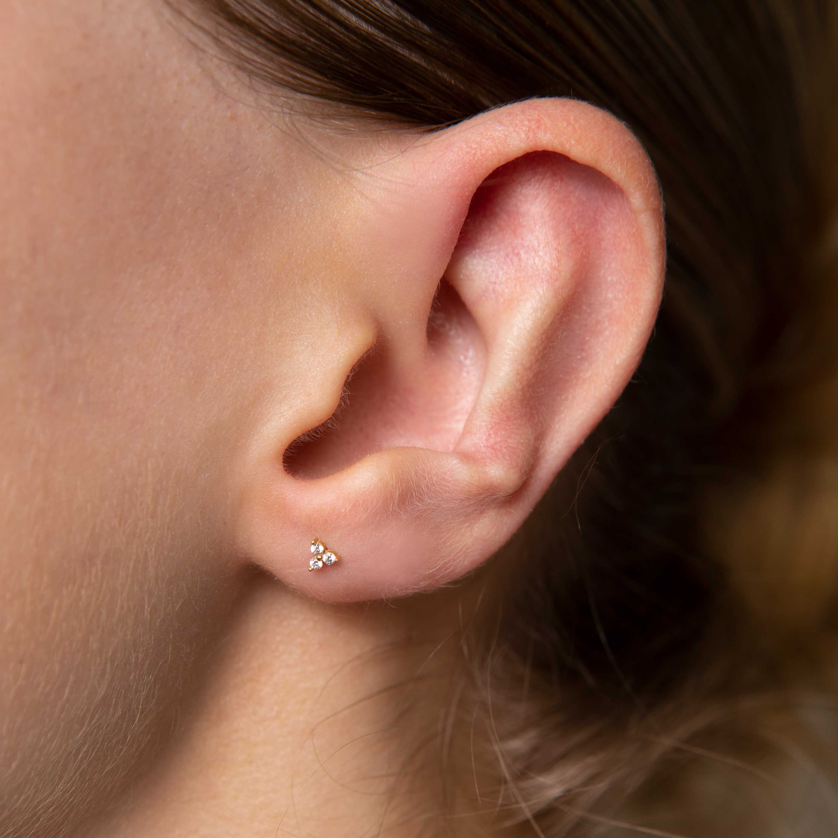 Triple Crystal Stud Earrings in Gold worn