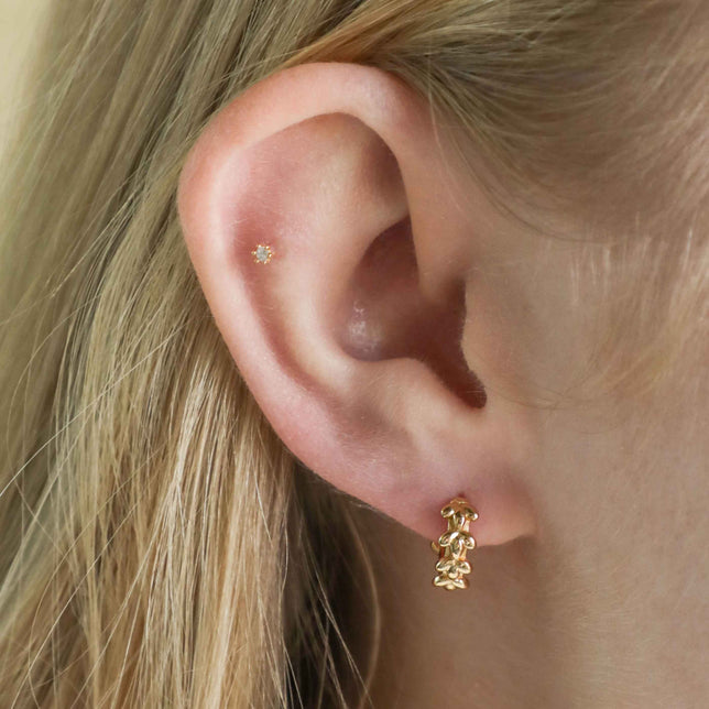 Flora Tiny Barbell in Gold worn in outer conch piercing